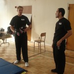 Keep Youth Doing Something (KYDS) Enrichment Leader Robert Chatley (left) talks to KYDS Enrichment Coordinator Erik Cruz (right) during a martial arts class at Van Nuys Middle School. The martial arts class is one of the many activities the KYDS after school program offers to youth. 
