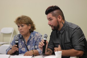 Alessandro Nagrete sitting next to his mother, Irma Montoya; translating from Spanish  language into English language for the audience  to understand his mother's experience as  a sick woman and undocumented.